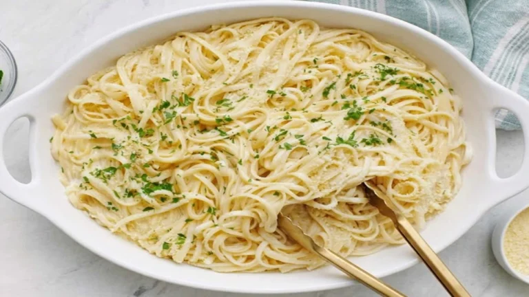 Creamy Cottage Cheese Pasta served in a blue bowl with parmesan and fresh herbs, a high-protein healthy pasta dish.