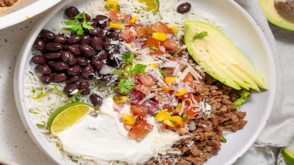 Cottage Cheese Taco Bowl with ground beef, black beans, rice, avocado, and fresh salsa a high protein healthy meal