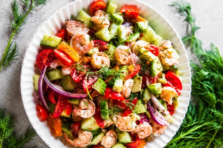 Fresh Shrimp Avocado Cucumber Salad served in a white bowl with juicy shrimp, creamy avocado, crisp cucumber, cherry tomatoes, red onion, and fresh dill.