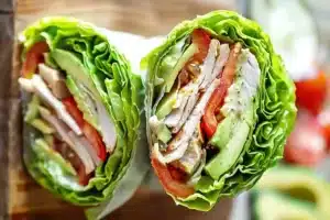 Keto Veggie Wrap for Busy Moms made with crisp lettuce, sliced turkey, avocado, tomatoes, and fresh vegetables for a quick and healthy low-carb lunch.